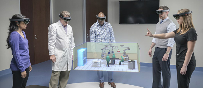 People using Microsoft HoloLens to share a view of a surgery room